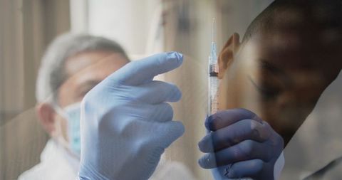 Doctor Preparing Vaccine Syringe, Child Asleep During COVID-19 - Download Free Stock Images Pikwizard.com
