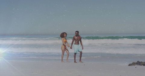 Romantic Couple Walking on Sunny Beach