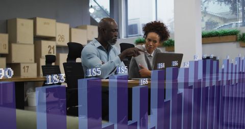 Diverse Colleagues Analyzing Digital Business Growth Data in Modern Office