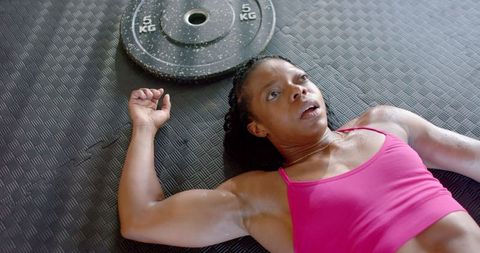 Exhausted Female Athlete Resting After Intense Workout - Download Free Stock Images Pikwizard.com