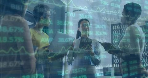 Diverse Female Team Collaborates Amidst Stock Market Data Visualization