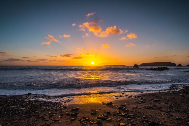 Stunning Sunset Over Ocean Waves and Sandy Beach - Download Free Stock Photos Pikwizard.com