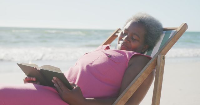 Senior Woman Relaxing on Beach Chair Reading Book at Seaside - Download Free Stock Images Pikwizard.com