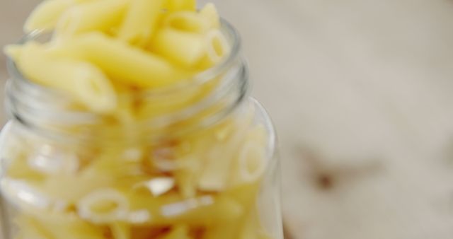 Close-up of Glass Jar Filled with Penne Pasta - Download Free Stock Images Pikwizard.com