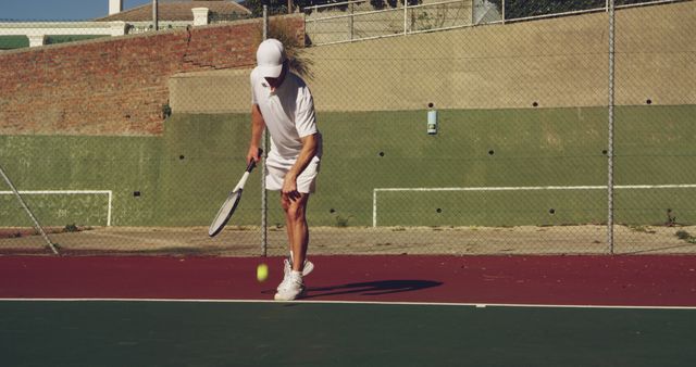 Senior Man Playing Tennis on Outdoor Court in Sunlight - Download Free Stock Images Pikwizard.com