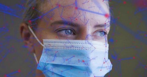 Woman wearing blue surgical mask looking right with digital network overlay and data nodes