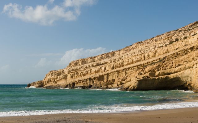 Matala beach cliff Crete - Download Free Stock Photos Pikwizard.com
