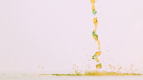 Colorful Liquid Drops in Super Slow Motion on White Background