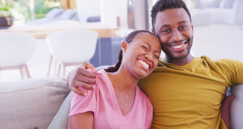 Joyful African American Couple Relaxing at Home