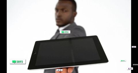 Businessman Presenting Tablet with Social Media Icons