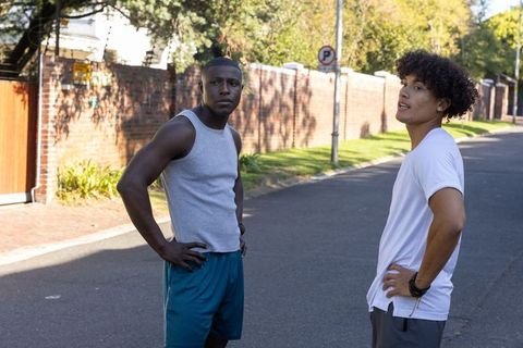 Diverse Male Friends Taking a Break During Suburban Morning Run