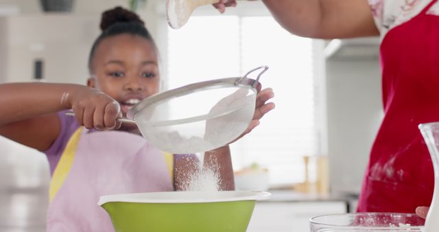 Child Sifting Flour with Parent in Modern Kitchen - Download Free Stock Images Pikwizard.com