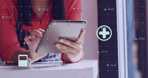 Businesswoman Analyzing Data on Tablet in Shop Setting