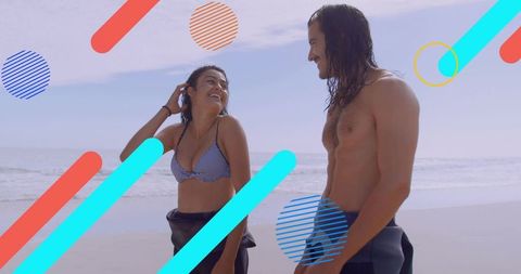 Young Couple Enjoying Seaside Getaway and Relaxing Beach Moments