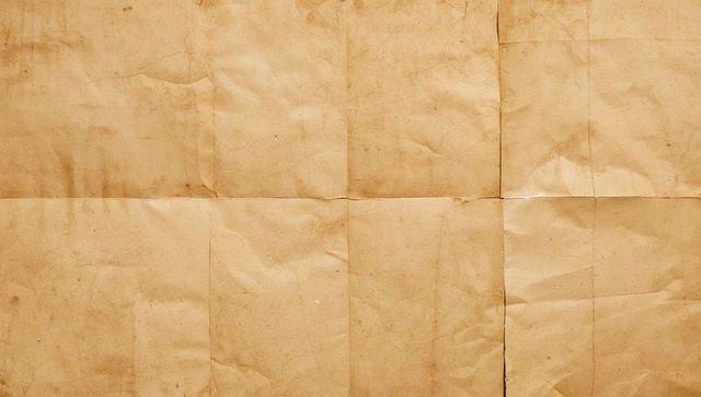 Displaying aged kraft paper with fold grid and creases for vintage texture background