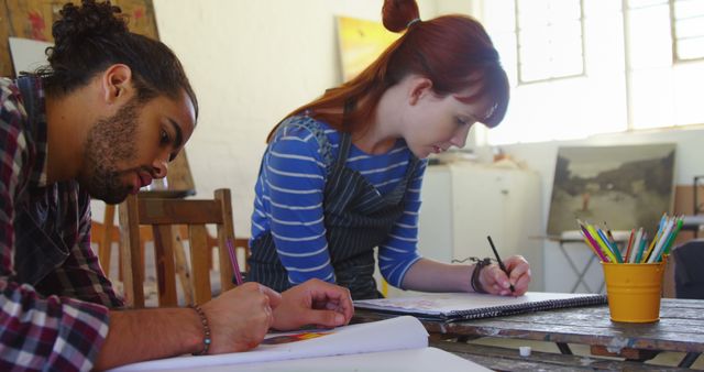Young artists working on sketches in art studio - Download Free Stock Images Pikwizard.com