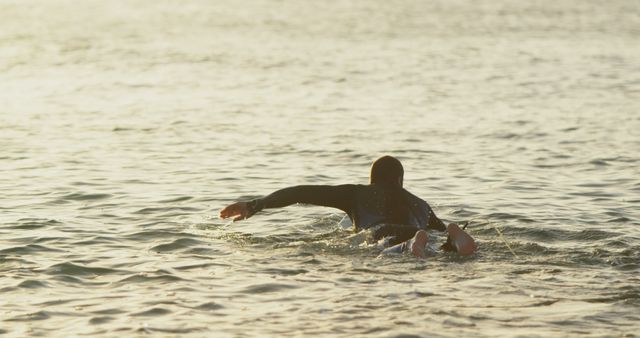 Surfer Paddling on Surfboard in Calm Ocean - Download Free Stock Images Pikwizard.com