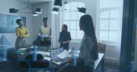 Diverse Female Coworkers Discuss Cloud Computing in Modern Office