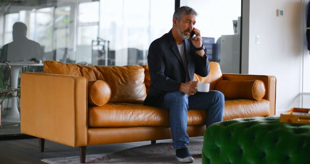 Mature Businessman Discussing on Phone in Modern Office - Download Free Stock Images Pikwizard.com