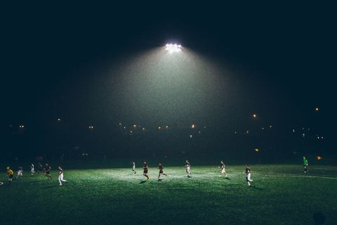 Night Soccer Match Under Bright Stadium Lights