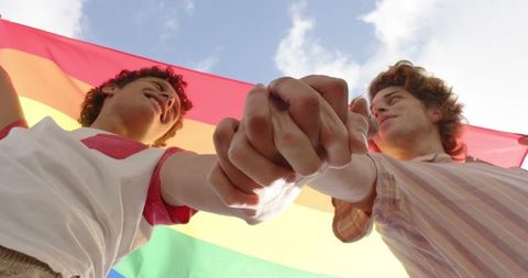Happy Diverse Gay Couple Holding Pride Flag in Celebration - Download Free Stock Images Pikwizard.com
