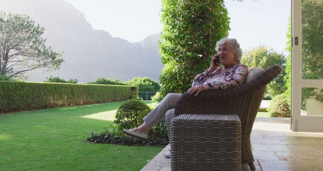 Senior Woman Enjoying Phone Call on Patio with Scenic Mountain View - Download Free Stock Images Pikwizard.com