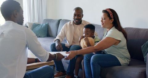 Diverse family consulting professional in cozy living room