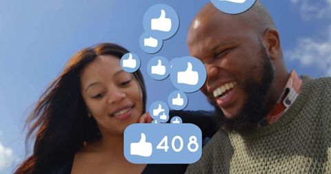 Smiling Couple Enjoying Social Media Engagement Outdoors