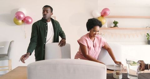 Friends Engaging in Conversation at Festive Dining Gathering