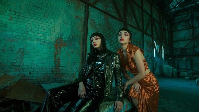 Avant-garde fashion models in industrial warehouse mood