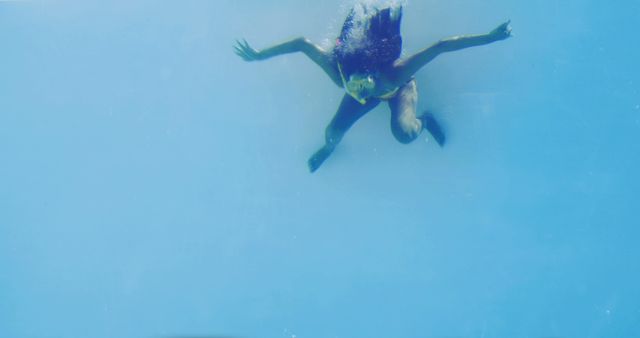 Underwater Swimmer Floating Gracefully in Clear Blue Water - Download Free Stock Images Pikwizard.com