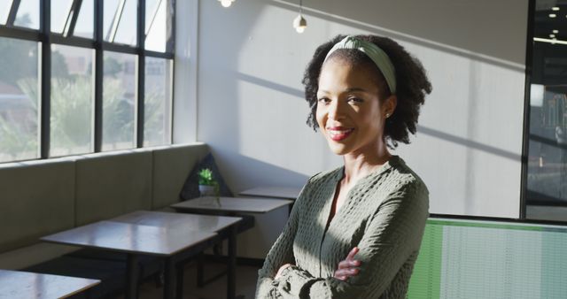Confident Young African American Businesswoman in Sunlit Office - Download Free Stock Images Pikwizard.com