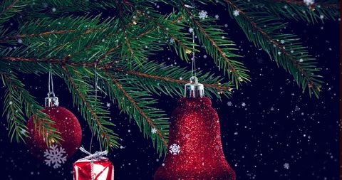 Christmas Ornaments and Gifts Hanging from Pine Branch with Snowflakes