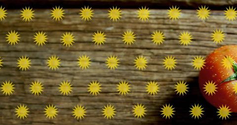 Ripe red tomato on rustic wood with yellow starburst overlay and copy space for text