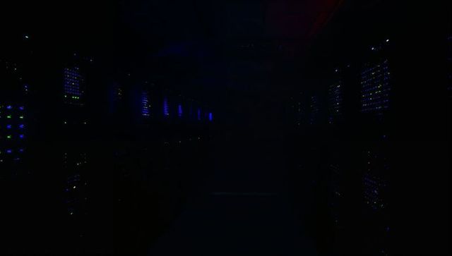 Dimly Lit Server Racks with LED Lights in Data Center