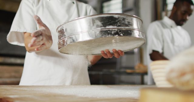 Bakers Sieving Flour in Artisan Bakery Kitchen - Download Free Stock Images Pikwizard.com