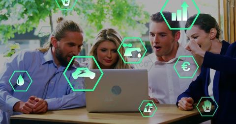 Startup team collaborating over green energy analytics dashboard on laptop