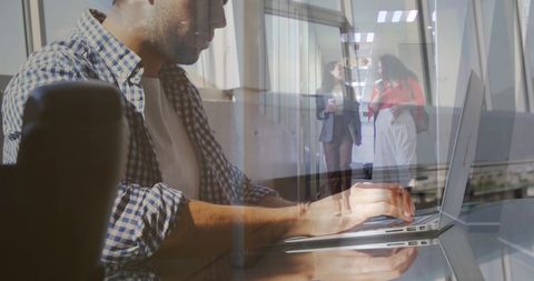 Double Exposure of Businessman Typing and Colleagues Walking - Download Free Stock Images Pikwizard.com