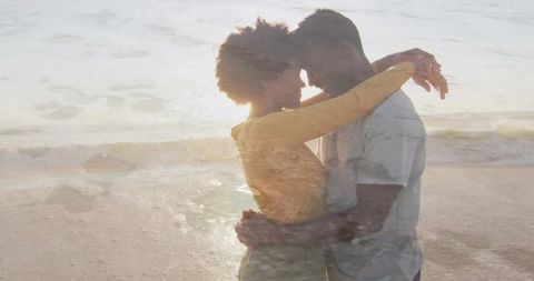 Embracing couple at golden hour double exposure on beach, intimate silhouette wave overlay
