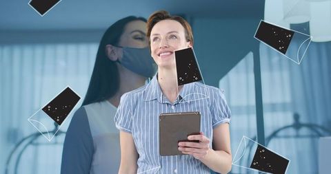 Businesswoman immersed in tech universe with floating smartphone icons