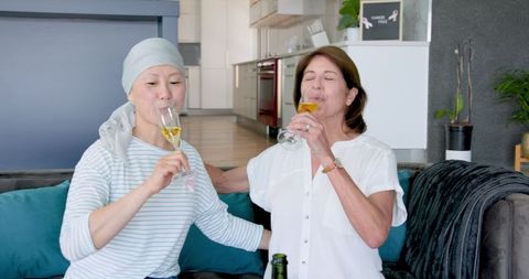 Joyful Senior Friends Celebrating Life Together with Champagne