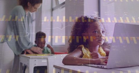 Young girl using laptop in classroom with data overlay, digital learning and analytics