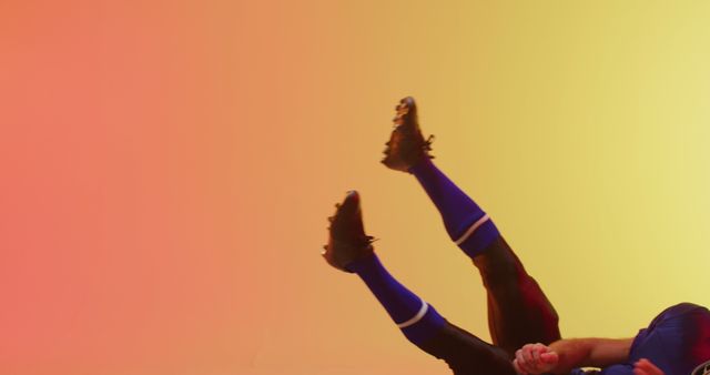 Soccer Player Falling on Colorful Gradient Background - Download Free Stock Images Pikwizard.com