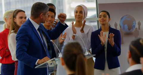 Diverse Business Team Celebrating Achievement at Seminar - Download Free Stock Images Pikwizard.com