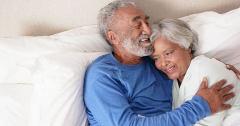 Senior Couple Relaxes at Home in Happy Embrace