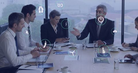 Diverse Team Discussing Sustainability and Efficiency in Modern Office