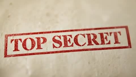Camera pulling back revealing red TOP SECRET stamp on aged parchment for close inspection