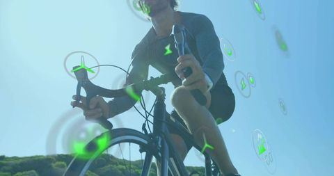 Cyclist pedaling with holographic energy icons in futuristic outdoors