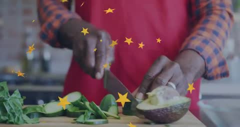 Senior Chef Preparing Avocado and Cucumber on Cutting Board with Animated Star Overlays