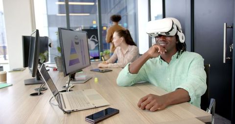 Employee Experiencing Virtual Reality Technology in Modern Office